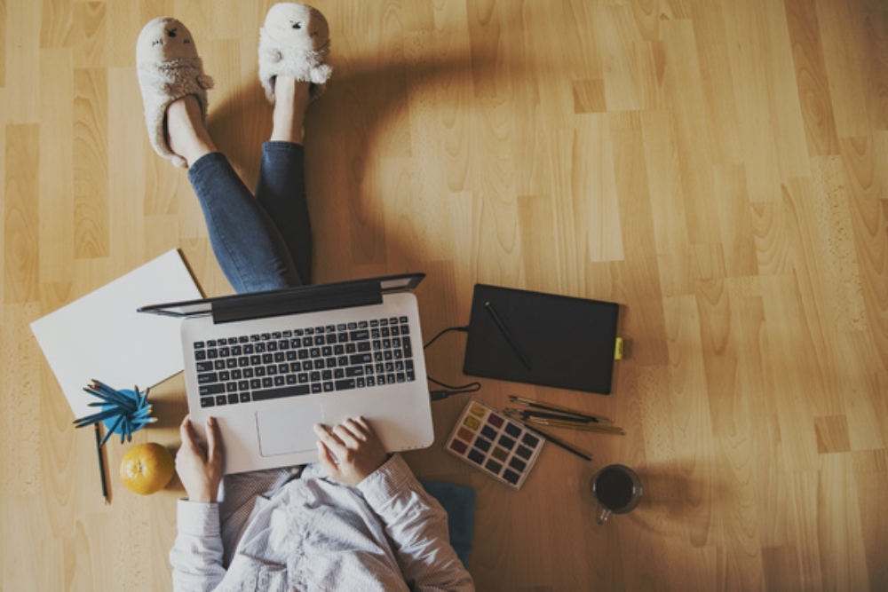 Sitting on the floor with a laptop